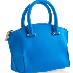 Beautiful elegance and luxury fashion women and blue leather handbag isolated on white background